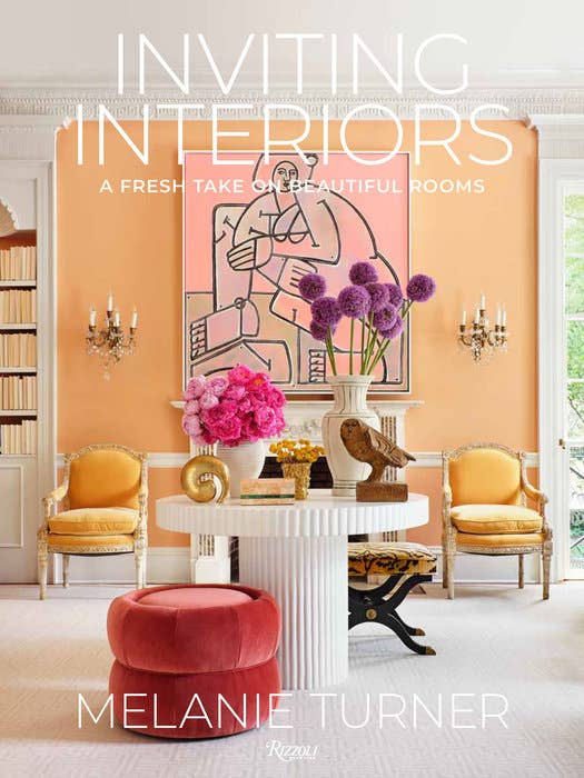 Open book from Inviting Interiors collection by Penguin Random House LLC showing cozy interior design tips and inspiring decor photos.