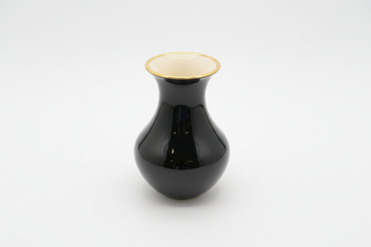 Vintage flower vase by The Vault Creative featuring a classic ceramic design with floral patterns and a narrow neck.