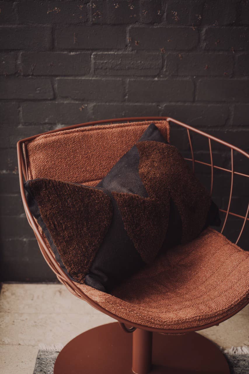 Abstract cushions in black and chocolate from Saardé featuring soft fabric and modern design for stylish home decor.