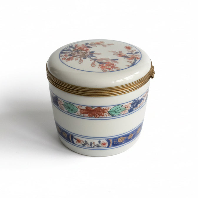 Vintage Limoges porcelain box with intricate hand-painted floral design, crafted by The Vault Creative.