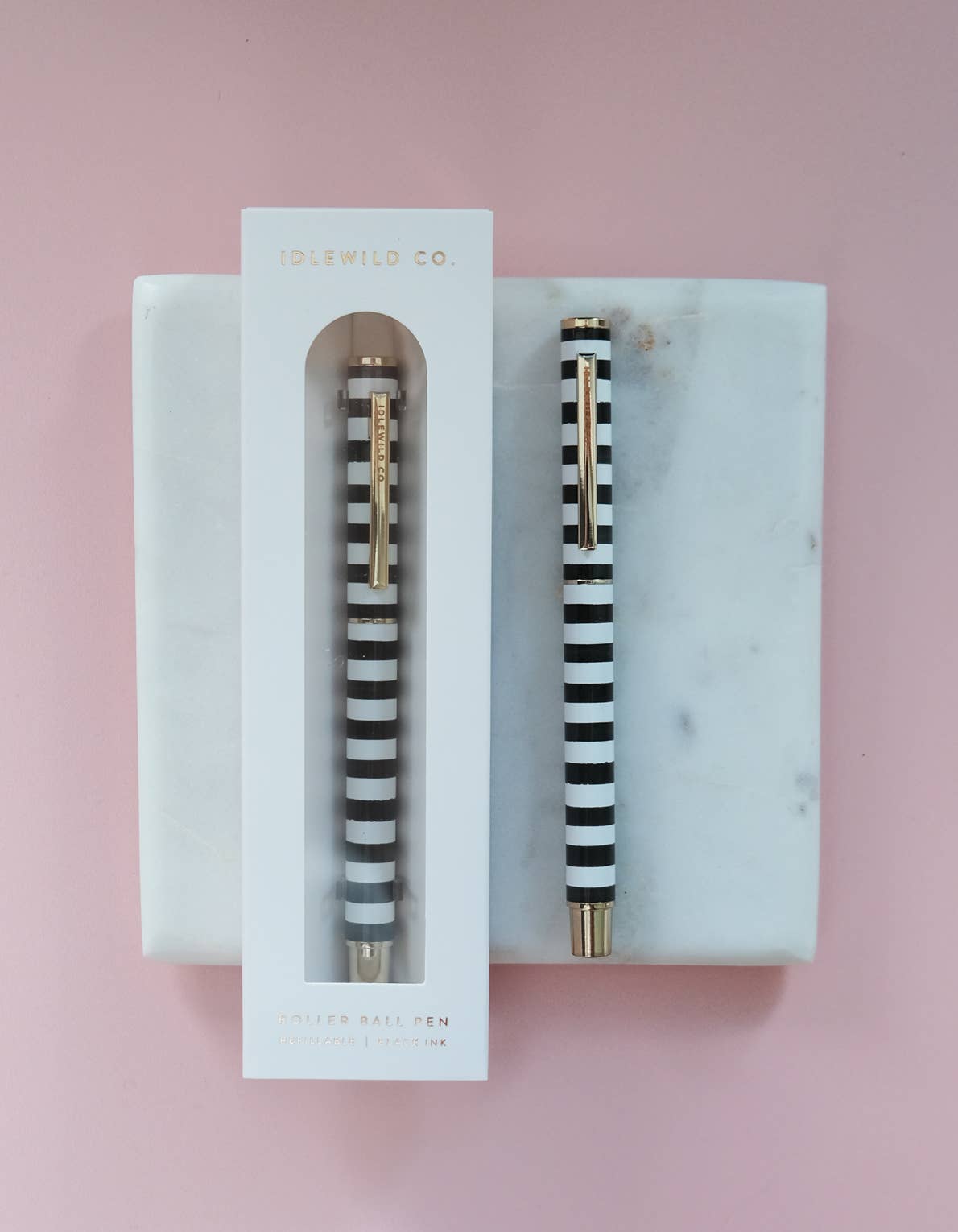 Black and white striped rollerball Luxe pen by Idlewild Co. with sleek design and elegant stripes, ideal for writing or gifting.