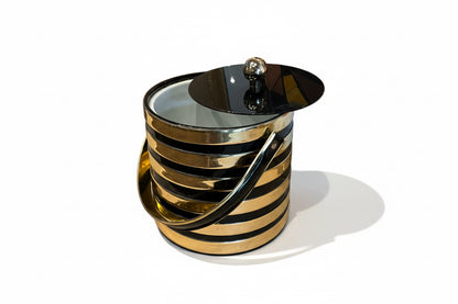 Vintage ice bucket by The Vault Creative with a sleek metal design and handle, perfect for keeping drinks chilled in style.