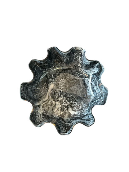 Big black gem stone resin bowl from Stone Textile Studio, featuring a smooth, glossy black surface with a rounded shape.