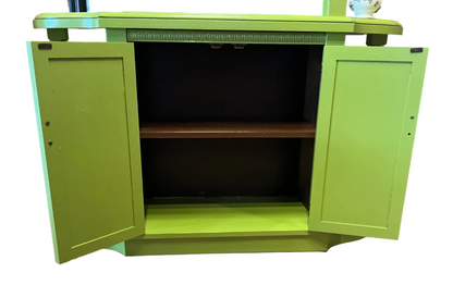Acid Green 70’s cabinets casepiece by The Vault Creative, featuring vibrant color and retro design with sleek wood finish.