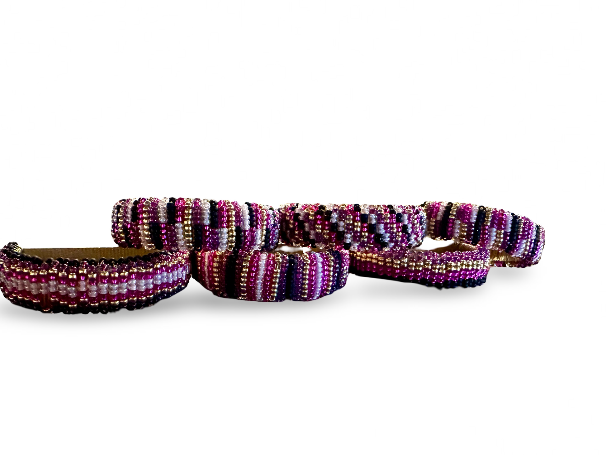 Set of six beaded napkin rings from The Vault Creative, featuring colorful beaded designs for elegant table settings.