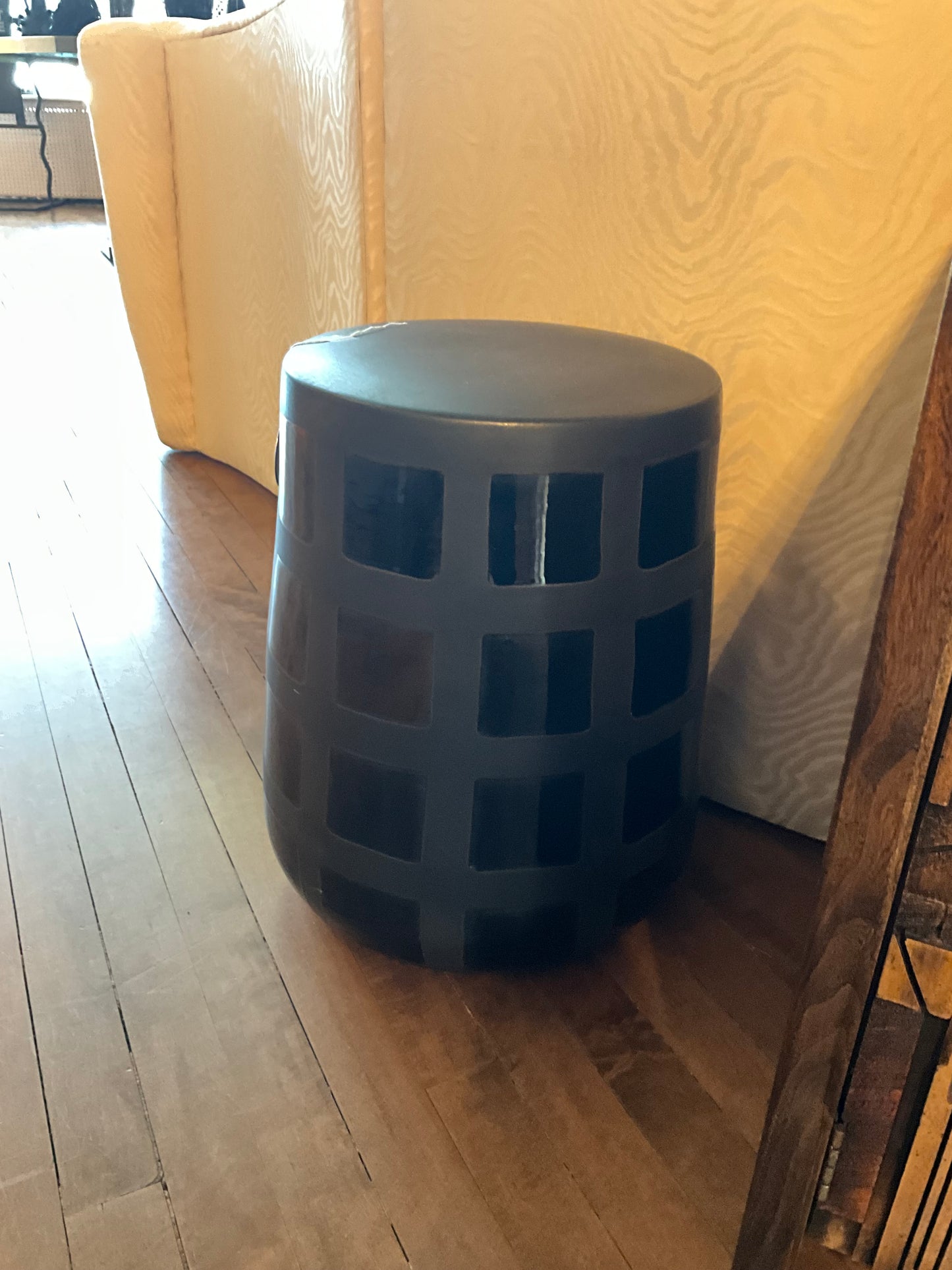 Ceramic patchwork stool by The Vault Creative featuring colorful ceramic tile design and wooden legs.