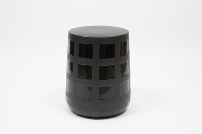 Ceramic patchwork stool by The Vault Creative featuring a colorful, artistic design and sturdy wooden legs.