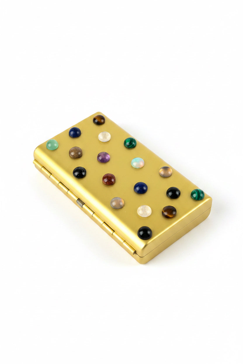 Turquoise cigarette case by P. Grunsfeld from The Vault Creative, featuring a sleek metal design with a turquoise finish.