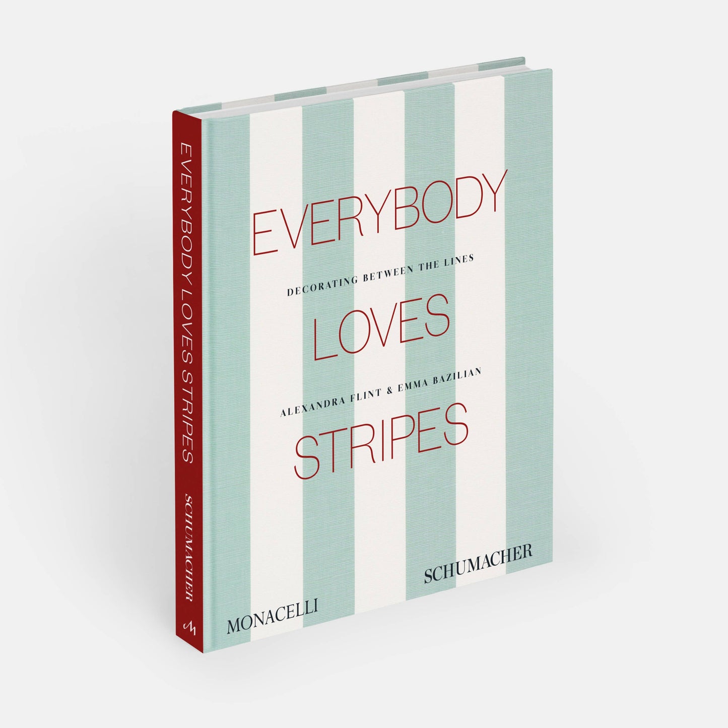 Open book titled "Everybody Loves Stripes: Decorating Between the Lines" by Phaidon, showcasing colorful striped patterns inside.