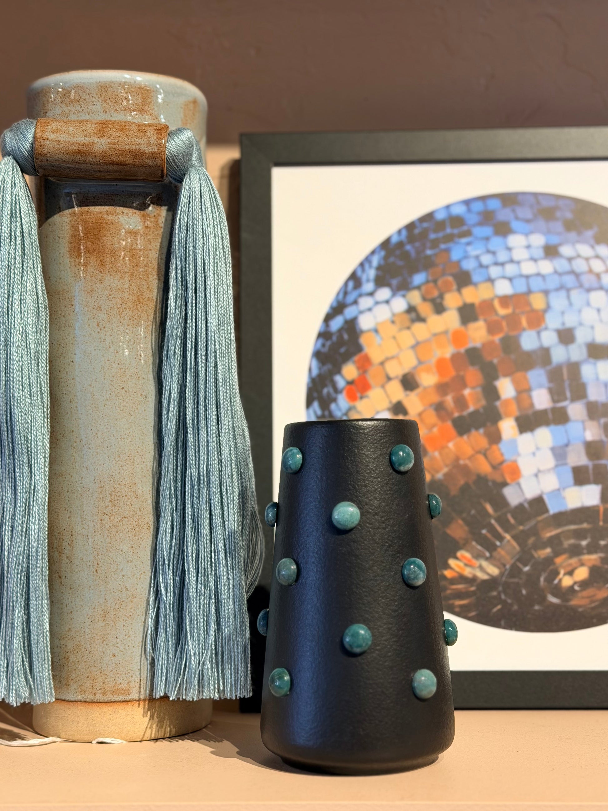 Stone studded 6-inch vase by P. Grunsfeld, featuring a textured design with embedded stones and a sleek, modern shape.