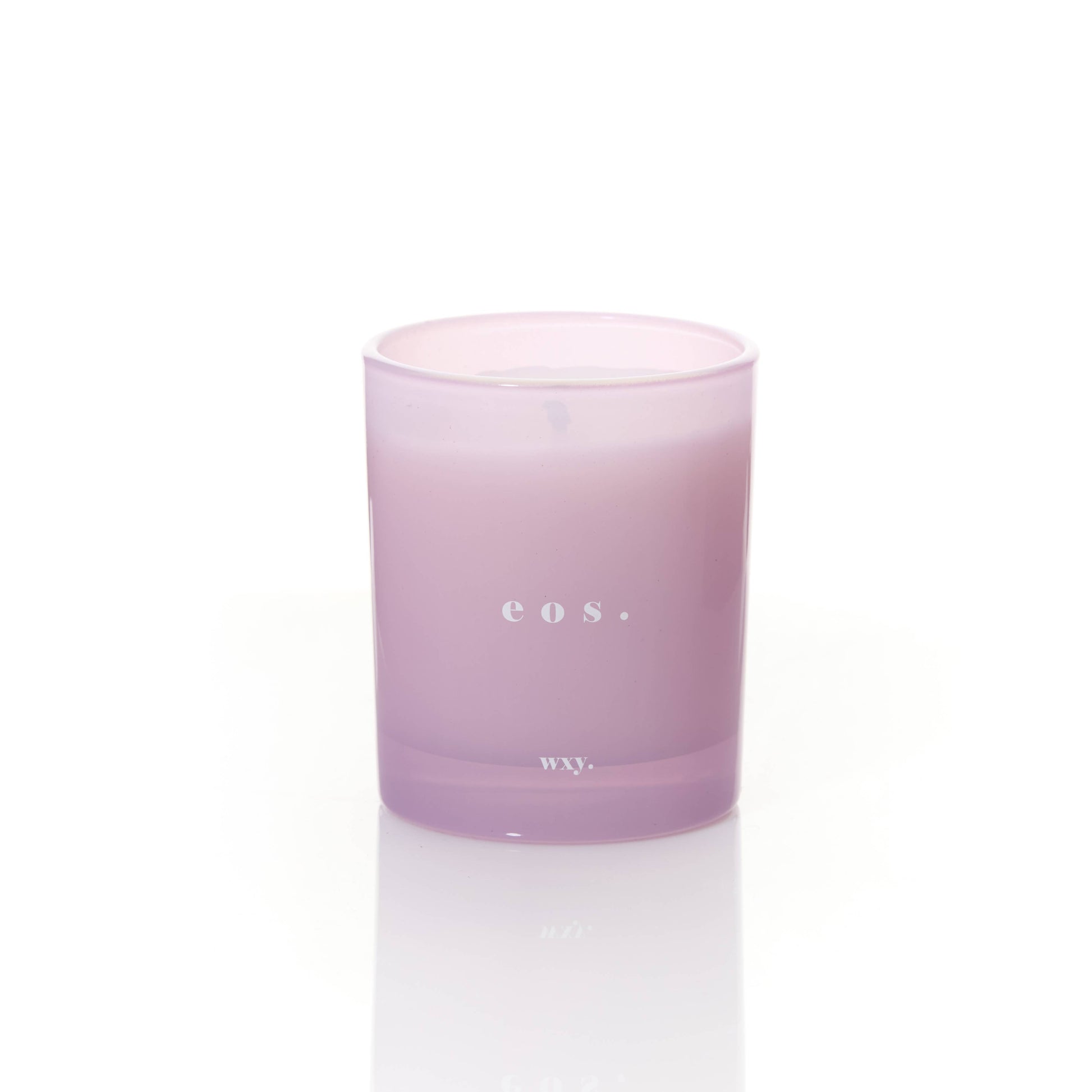 WXY eos 7oz candle featuring Orris Root and Amber scent, shown with the candle in a glass jar and a lit wick.