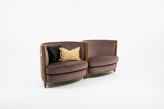 Curved purple chairs by The Vault Creative with modern design and smooth upholstery, shown from different angles.
