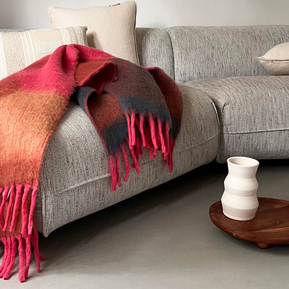 Malagoon Zapotec soft pink recycled throw blanket with woven texture and fringed edges