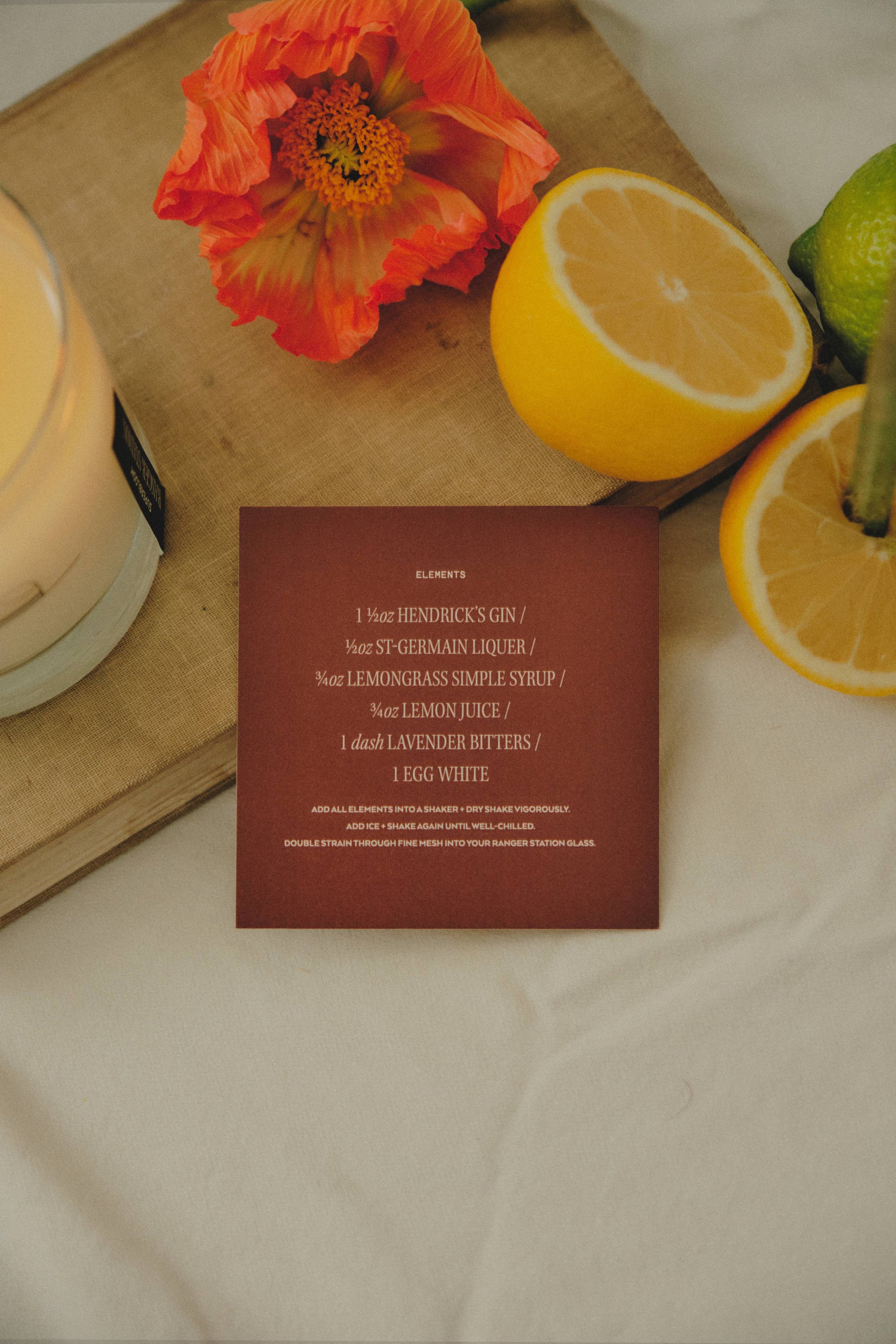 Ozmun Home Superbloom Candle with floral design in a glass jar, showcasing vibrant colors and elegant packaging.