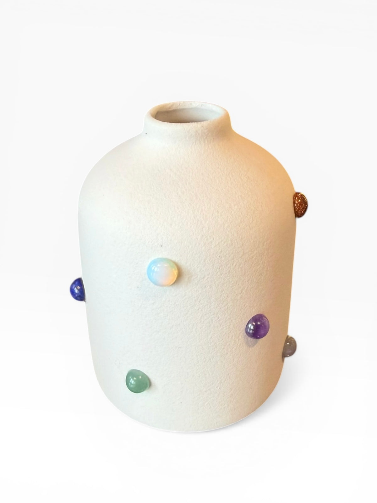 Phoebe P. Grunsfeld June Bud Vase with a sleek, minimalist design, showcasing a smooth ceramic surface and elegant shape.