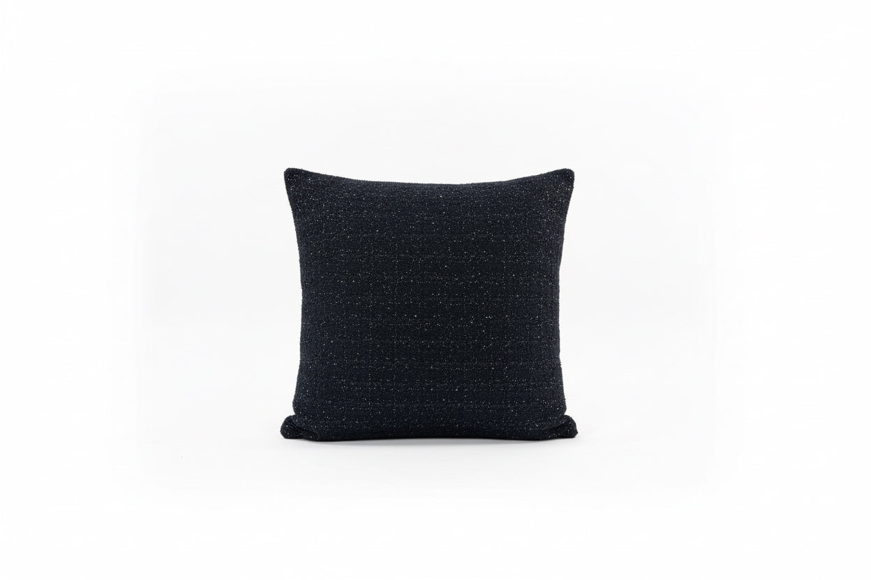 Black tweed pillow with sequin accents from The Vault Creative, featuring textured fabric and decorative embellishments.
