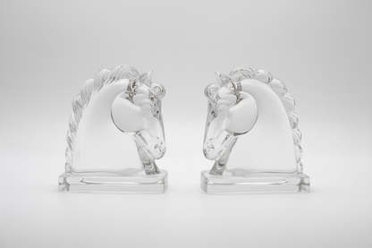 Pair of glass horse bookends by The Vault Creative, featuring sleek, transparent horse-shaped decorative book supports.