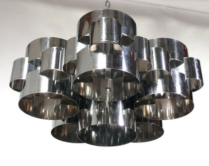 Chrome Cloud Chandelier by Ozmun Home featuring a modern, cloud-inspired design with sleek chrome finish and multiple hanging elements.
