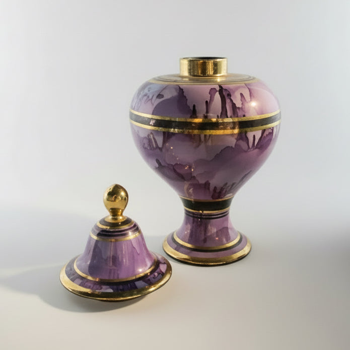 Purple watercolor vessel by The Vault Creative with a smooth ceramic surface and artistic purple and blue watercolor design.