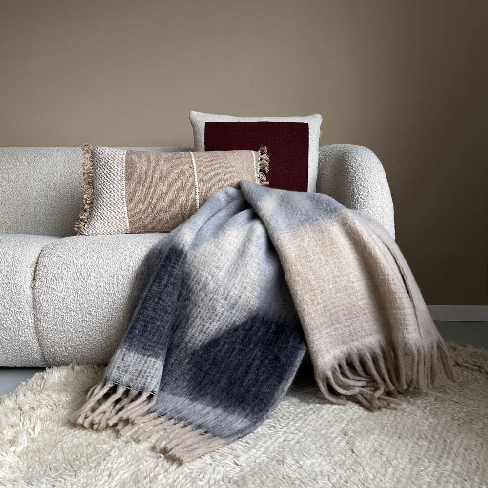Malagoon Zapotec soft grey recycled throw blanket with textured weave folded neatly