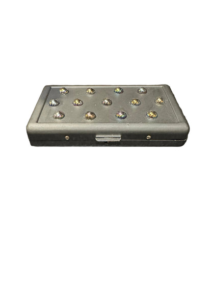 Black P.Grunsfeld cigarette case by The Vault Creative with oil-slicked gem accents, sleek and stylish accessory.