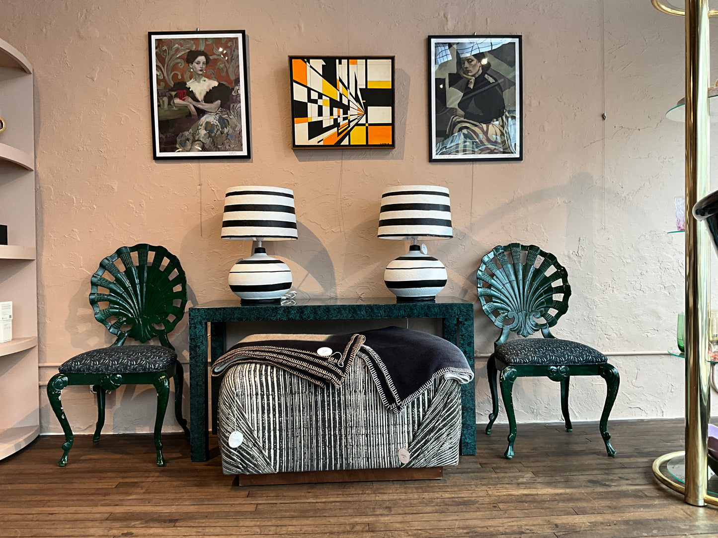 Faux Malachite console table by The Vault Creative with sleek black metal legs and vibrant green faux stone surface.