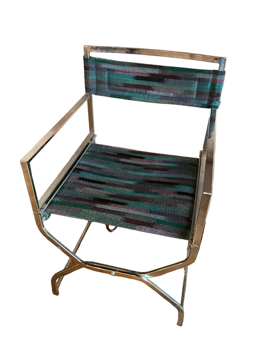 Pair of vintage chrome directors chairs with wooden armrests and fabric seats, classic style from The Vault Creative.