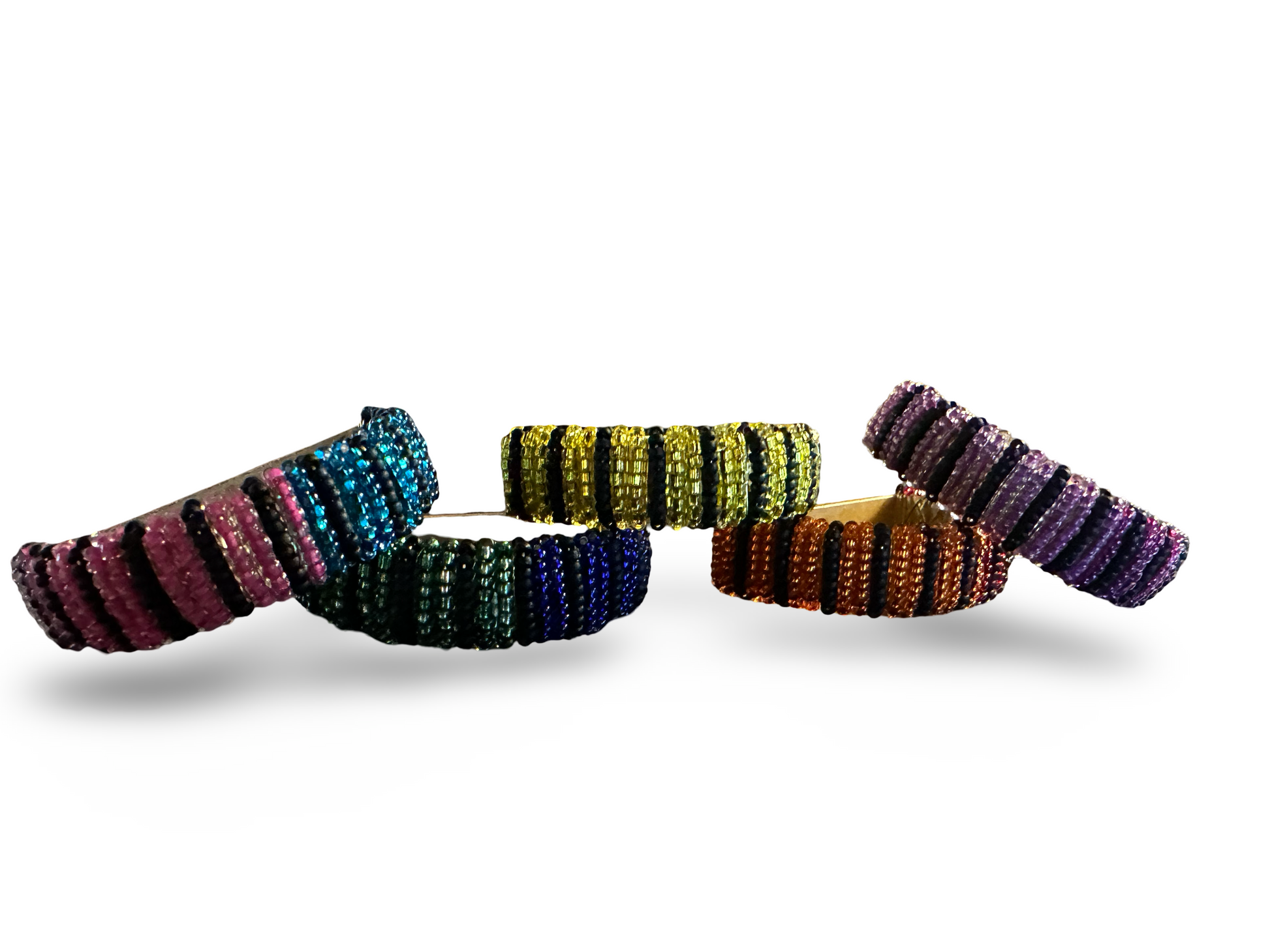 Set of five Phoebe beaded napkin rings with colorful, intricate beadwork ideal for elegant table settings.