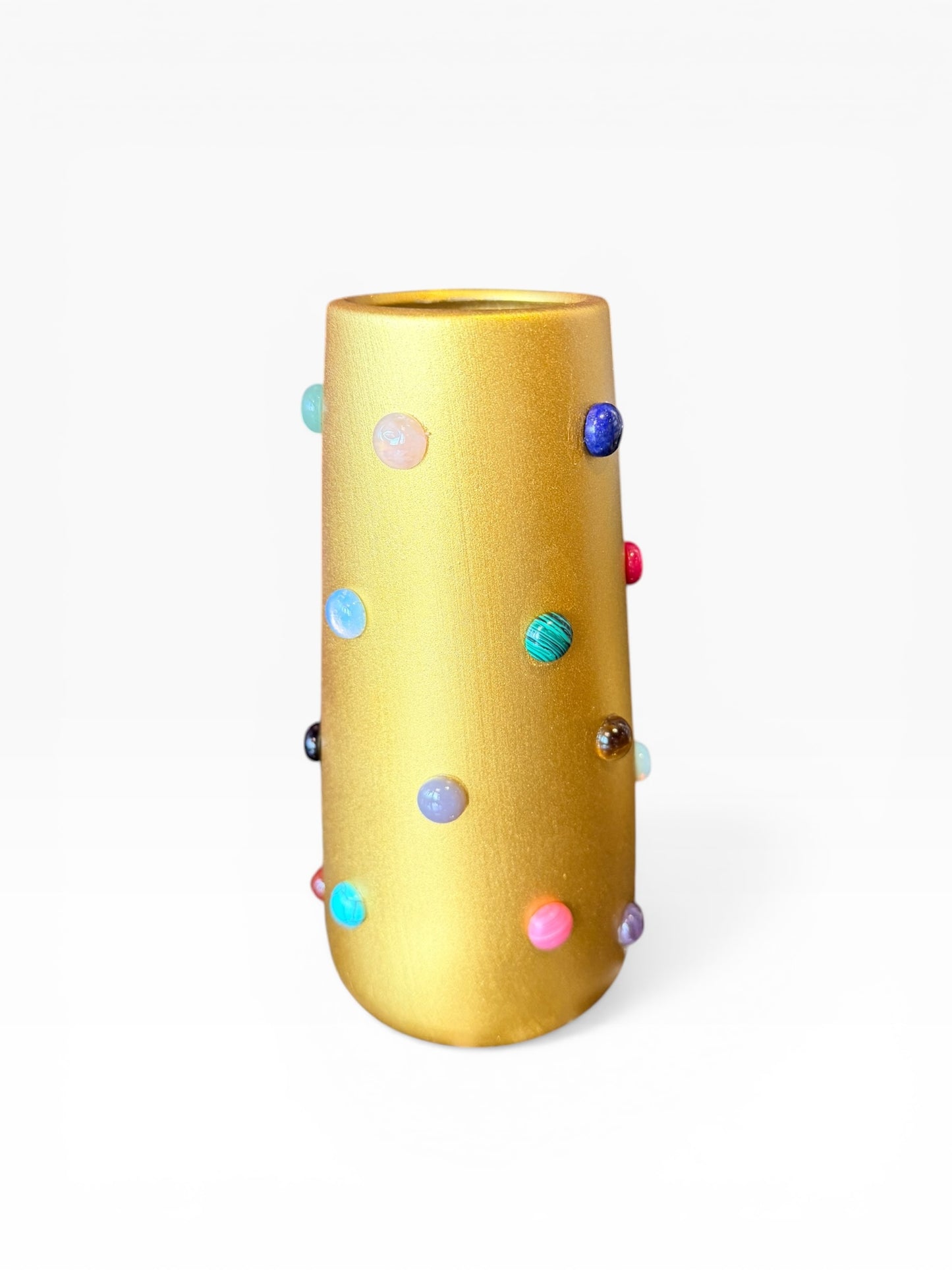 Gold vase by P.Grunsfeld from The Vault Creative, showcasing a sleek, modern design with a shiny metallic finish.