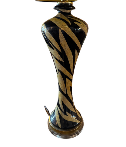 Tiger striped lamp by The Vault Creative with bold black and orange tiger pattern, modern table lamp design.