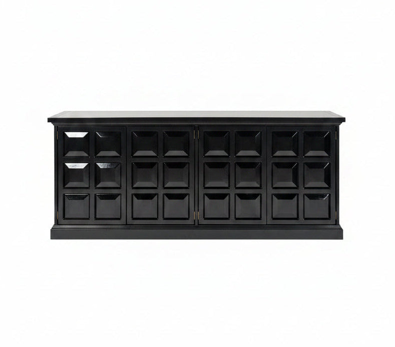 Modern interior with geometric abstract art on a wall above a black cabinet.