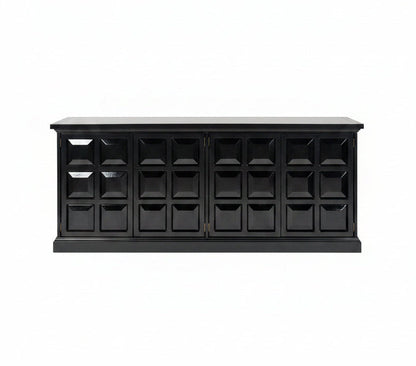 Modern interior with geometric abstract art on a wall above a black cabinet.