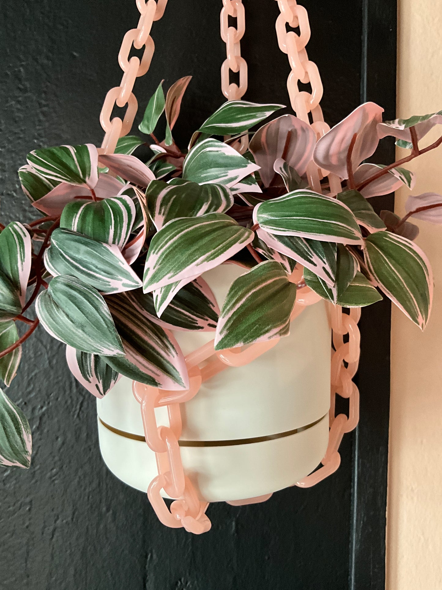 Pink chain hanging planter by The Vault Creative, featuring a stylish design perfect for indoor plants and home decor.