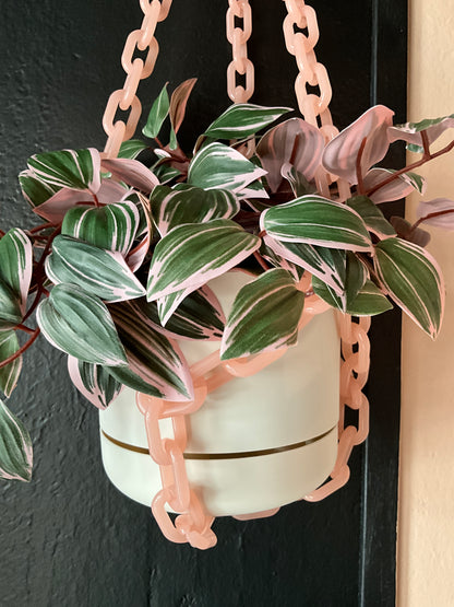 Pink chain hanging planter by The Vault Creative, featuring a stylish design perfect for indoor plants and home decor.
