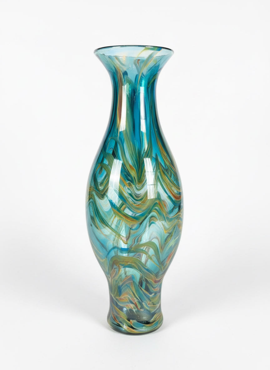 Blue swirl vase by The Vault Creative, showcasing a ceramic design with vibrant blue and white swirling patterns.