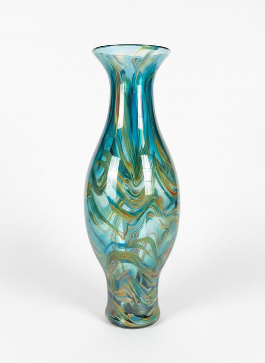 Blue swirl vase by The Vault Creative, showcasing a ceramic design with vibrant blue and white swirling patterns.