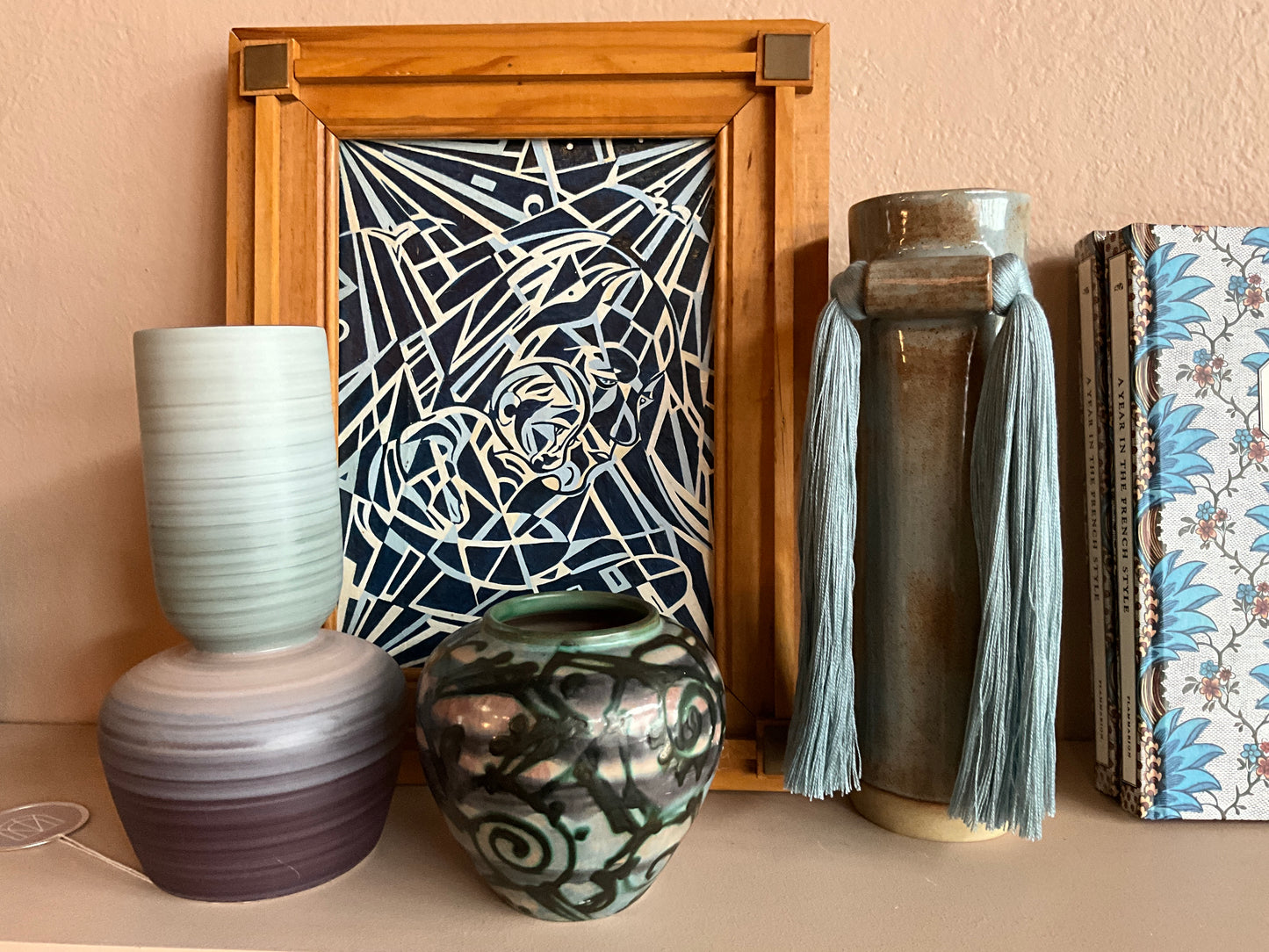 Vintage Asian tribal vase with intricate patterns and earthy tones, crafted by The Vault Creative.
