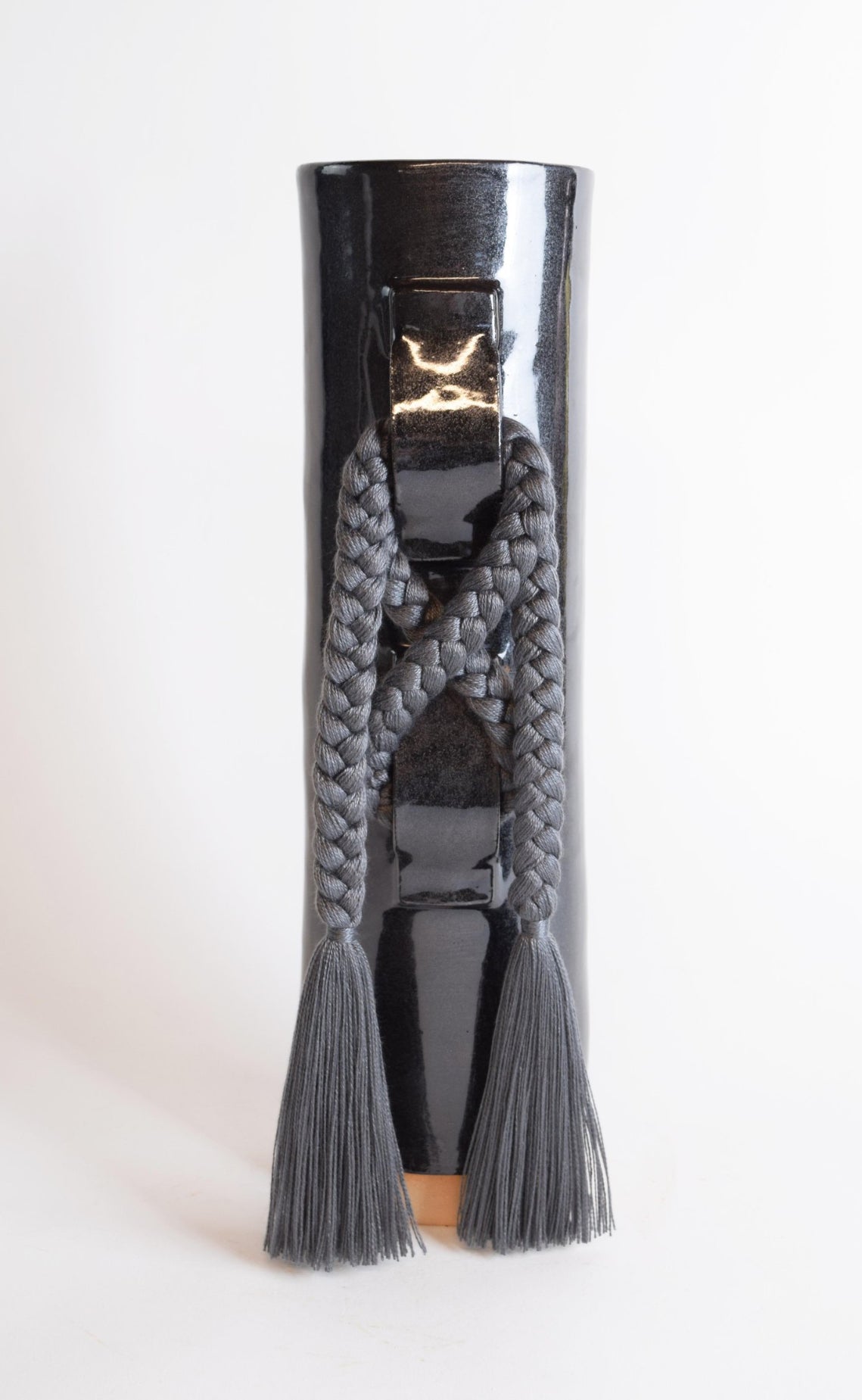 Black Karen Tinney Criss Cross Vase by Ozmun Home, showcasing the stylish ceramic design with textured criss cross pattern.