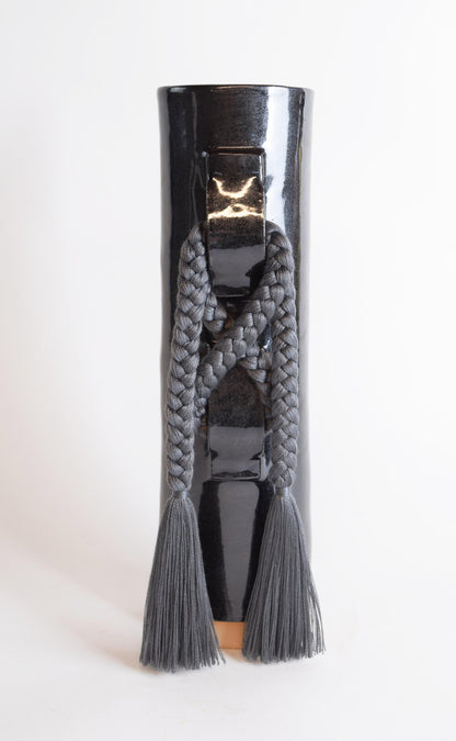Black Karen Tinney Criss Cross Vase by Ozmun Home, showcasing the stylish ceramic design with textured criss cross pattern.