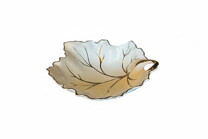 Vintage Limoges porcelain leaf dish with intricate floral details, handcrafted by The Vault Creative.