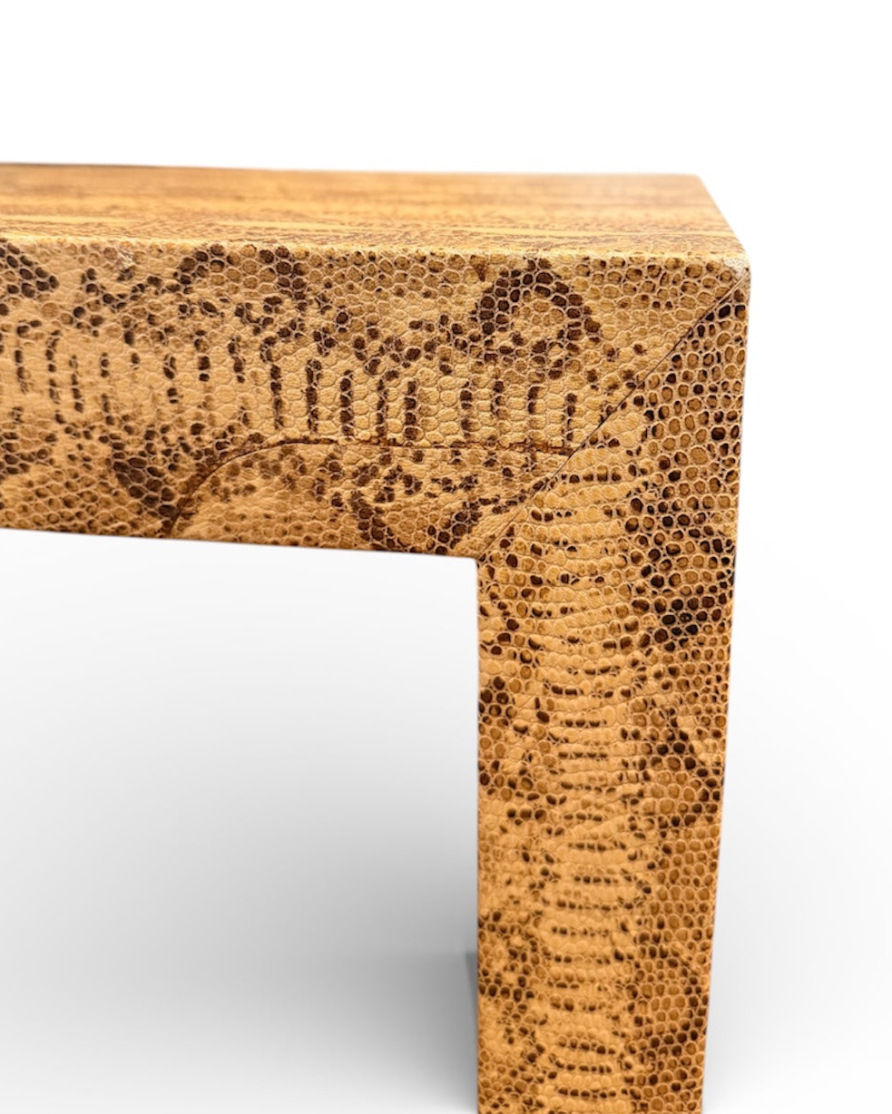Vintage custom snakeskin coffee table by The Vault Creative featuring a sleek, textured snakeskin surface and modern design.