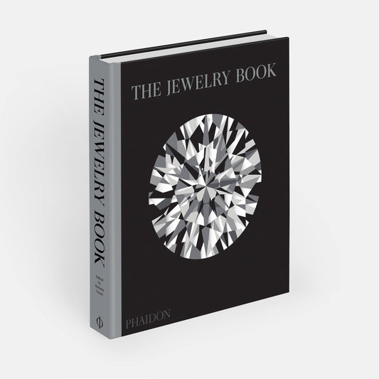 The Jewelry Book by Phaidon, a hardcover book featuring images and information about jewelry design and history.