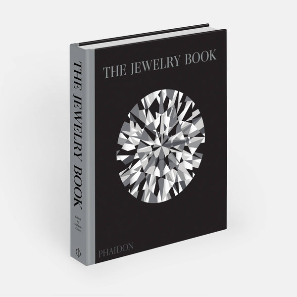 The Jewelry Book by Phaidon, a hardcover book featuring images and information about jewelry design and history.