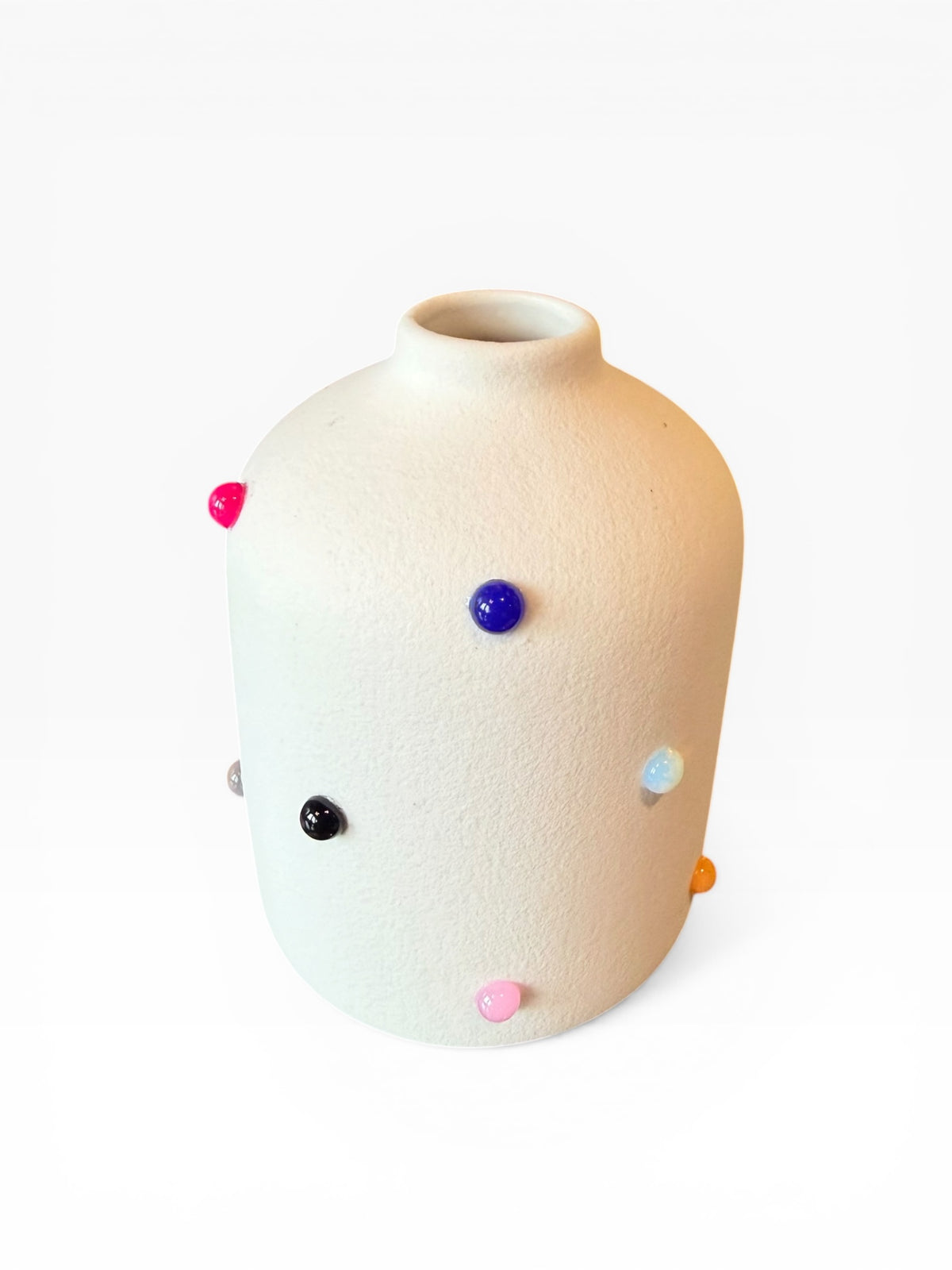 Phoebe P. Grunsfeld June Bud Vase in ceramic with a smooth, rounded shape and a subtle floral pattern.