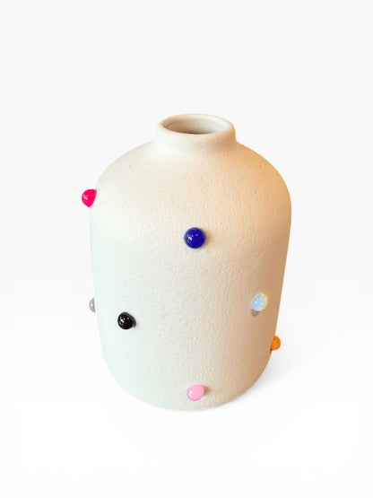 Phoebe P. Grunsfeld June Bud Vase in ceramic with a smooth, rounded shape and a subtle floral pattern.