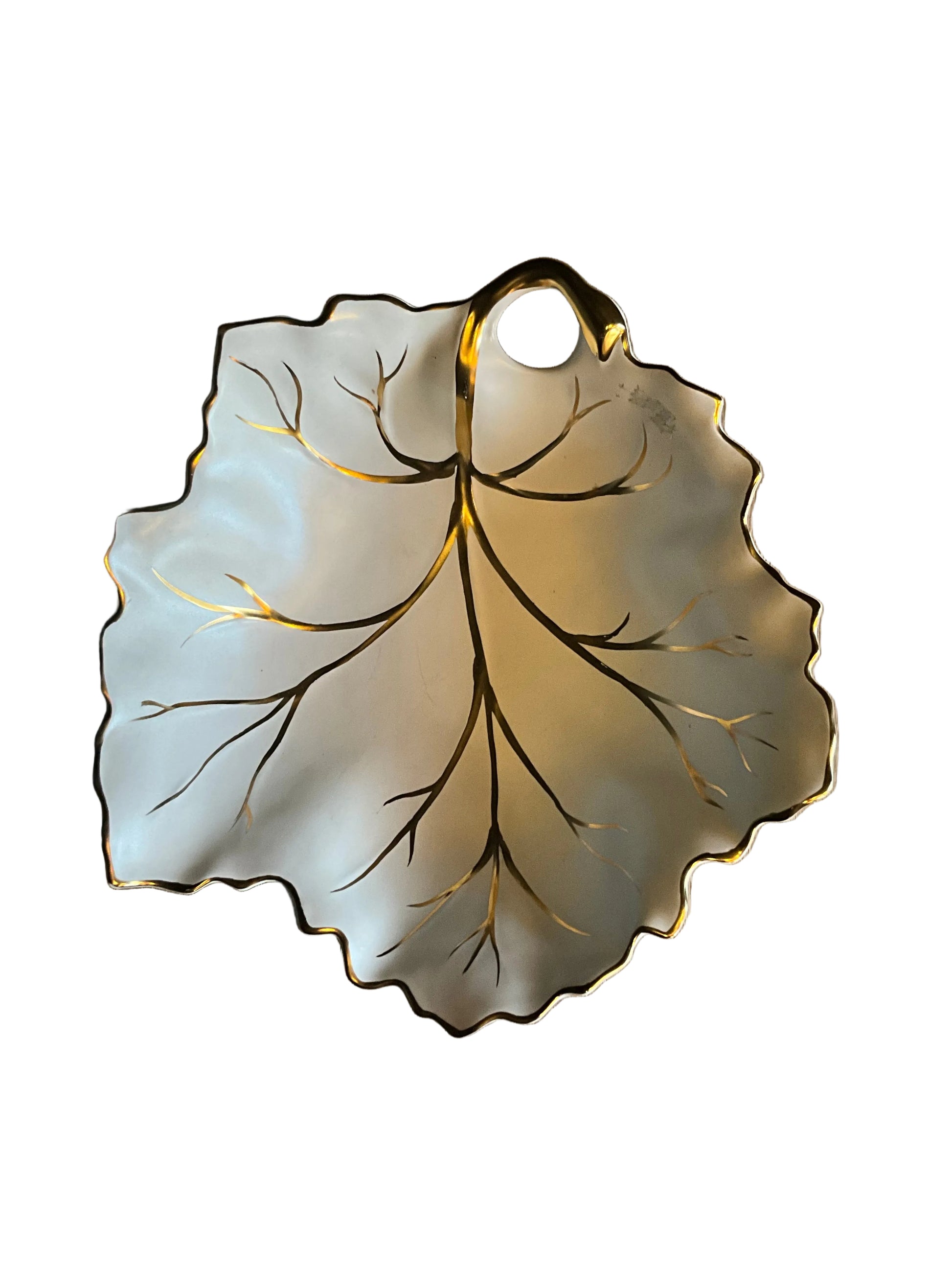 Vintage Limoges porcelain leaf dish with intricate floral design, crafted by The Vault Creative, showcasing delicate craftsmanship.