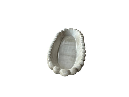 Handmade concrete bowl with antique marble finish by Atelier La Rouleuse, showcasing a large, stylish, textured interior design.