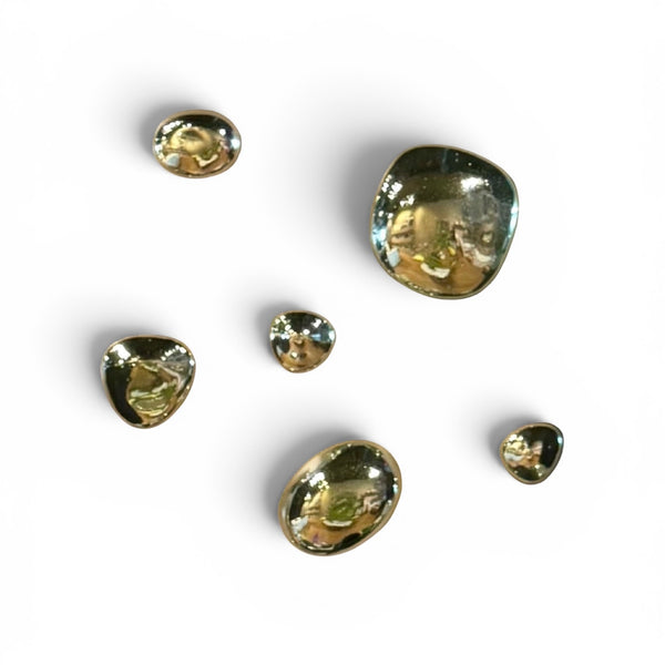 Glass Water Orbs by Stone Textile Studio, clear spherical decorative glass orbs on a neutral background.