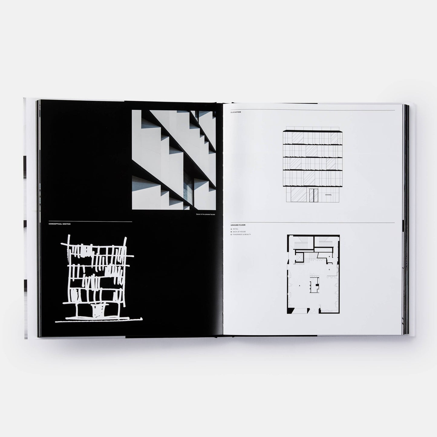Open book titled "The Architecture of Chanel" by Phaidon, showing pages with black and white photographs of Chanel's architectural designs.