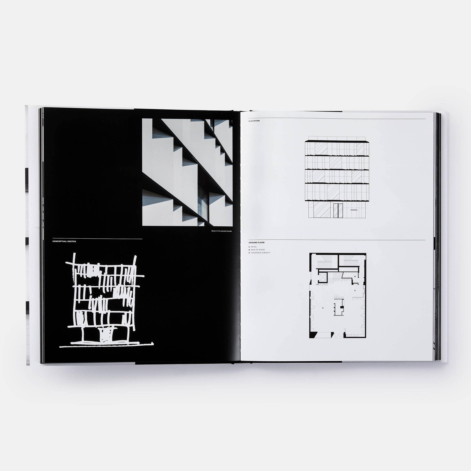 Open book titled "The Architecture of Chanel" by Phaidon, showing pages with black and white photographs of Chanel's architectural designs.